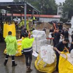 Brethren charity RRT work hard to fill sandbags during QLD flood emergency